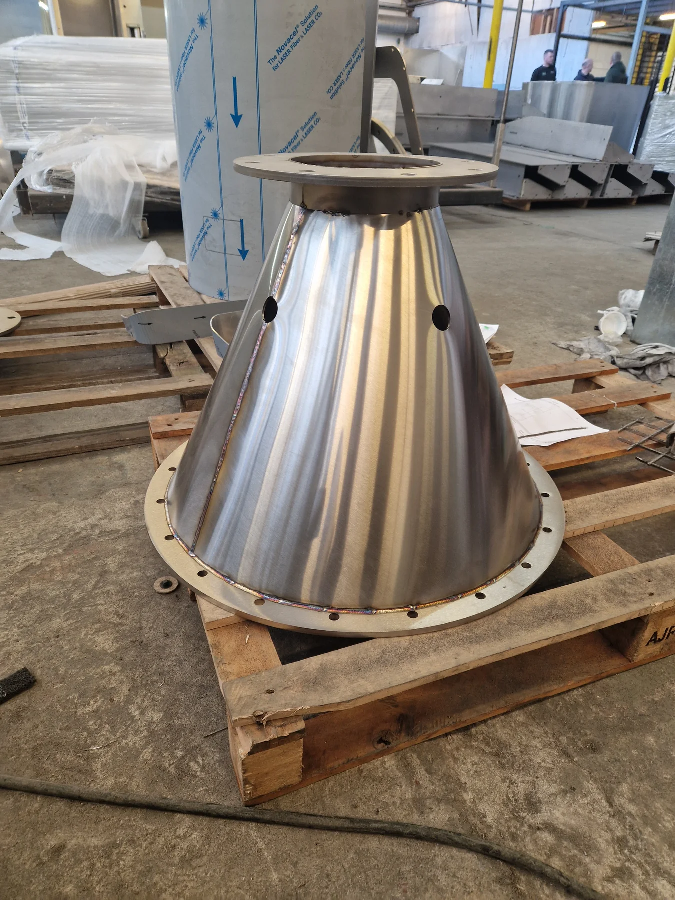 Polished conical fabricated component in the Zeus workshop